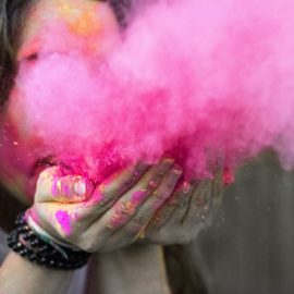 shallow-focus-photograph-of-woman-blowing-pink-powder-612977